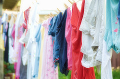 image of clothes on a line explaining that drying clothes indoors leads to bad odours and condensation
